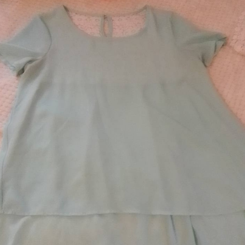 Teal top with lace back.